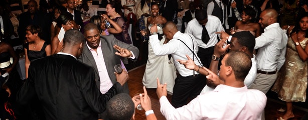 People dancing at crowded indoor corporate party